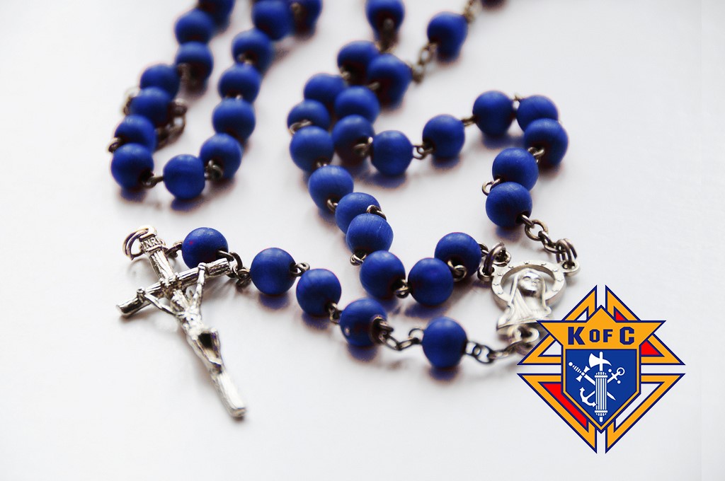 an image of the rosary with the Knights of Columbus logo